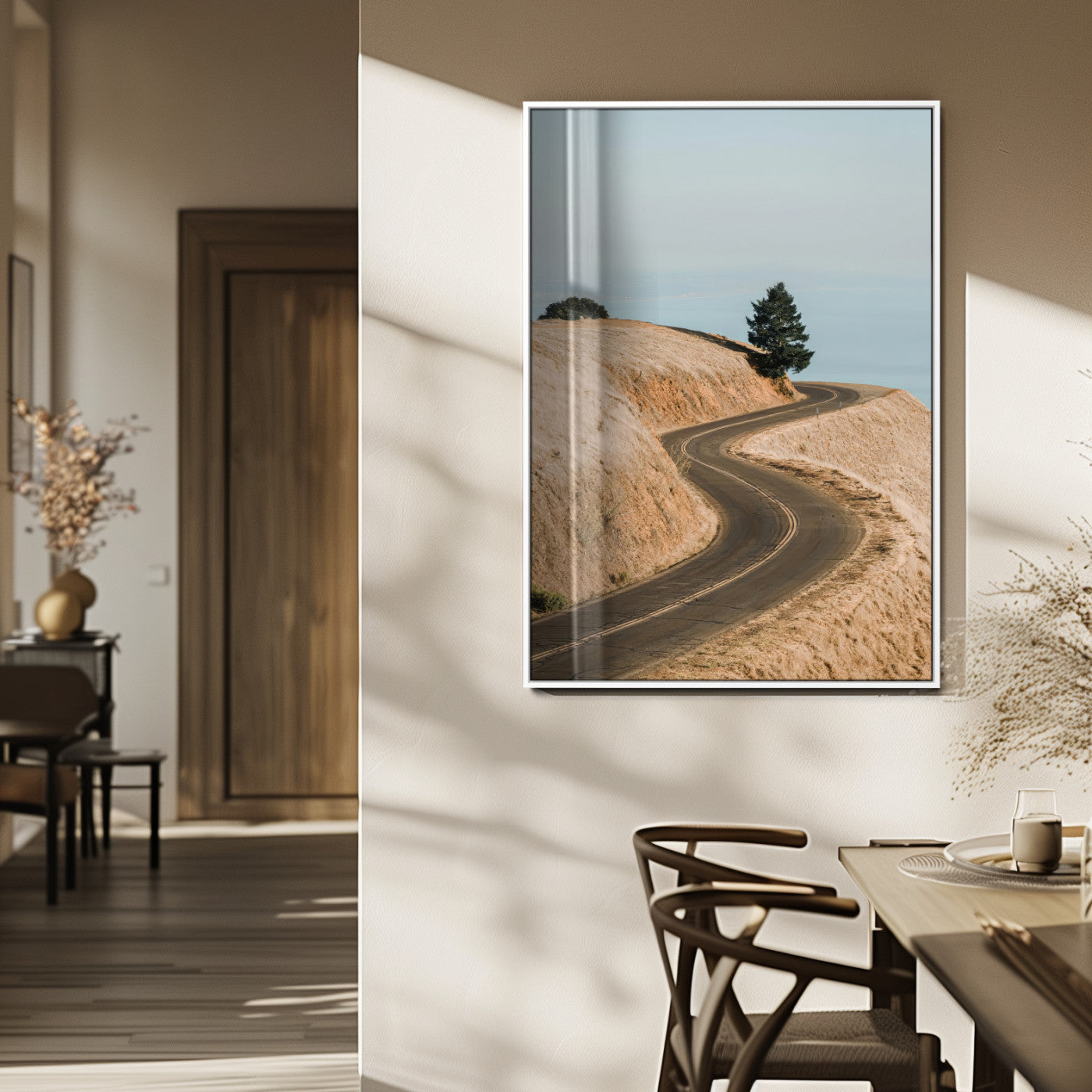 Earth-toned photograph of a winding road through golden hills, ideal for neutral or rustic-themed decor with a calming travel vibe.