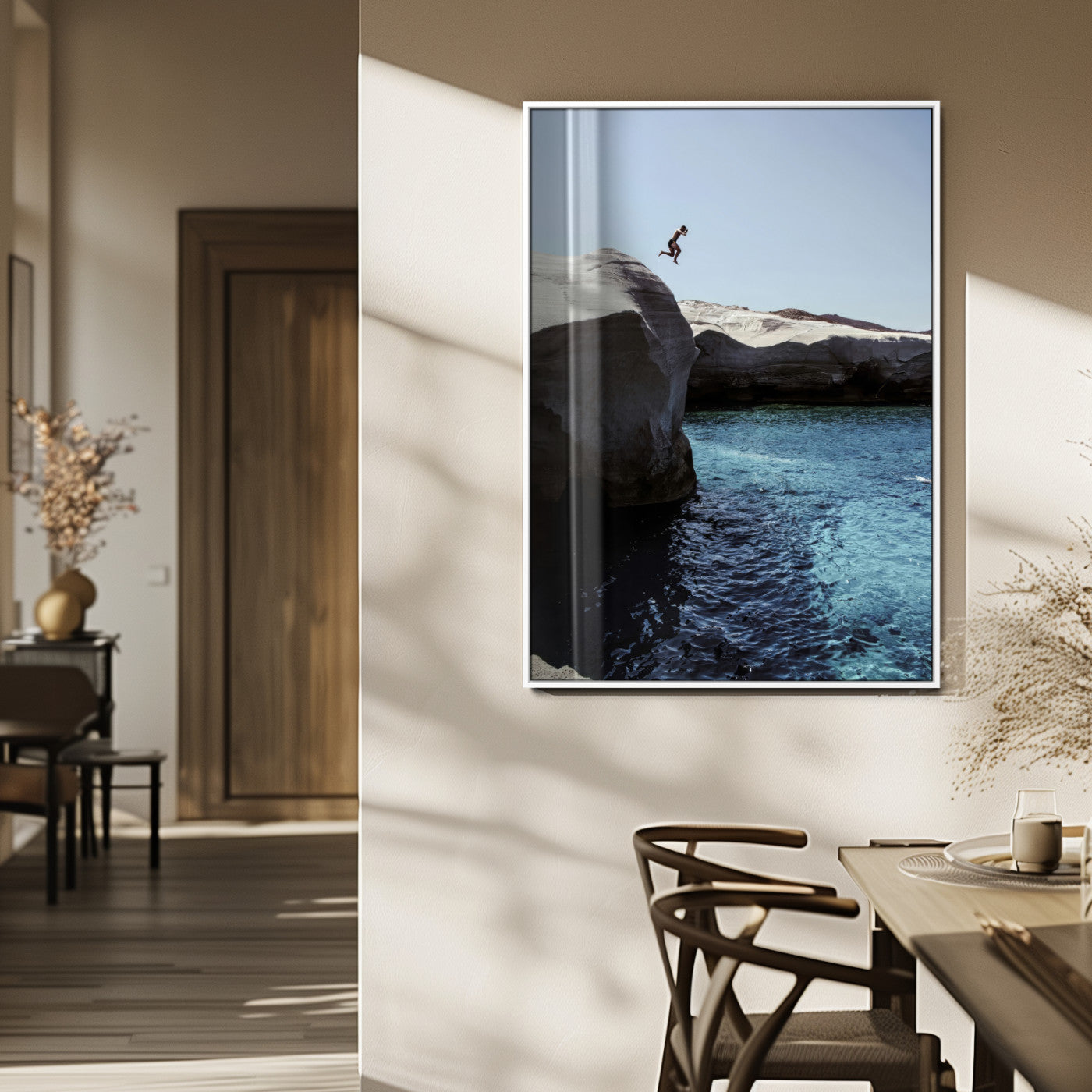 Canvas of a cliff diver above turquoise waters and rocky coastline under clear sky, ideal for adventurous minimalist or coastal home decor.
