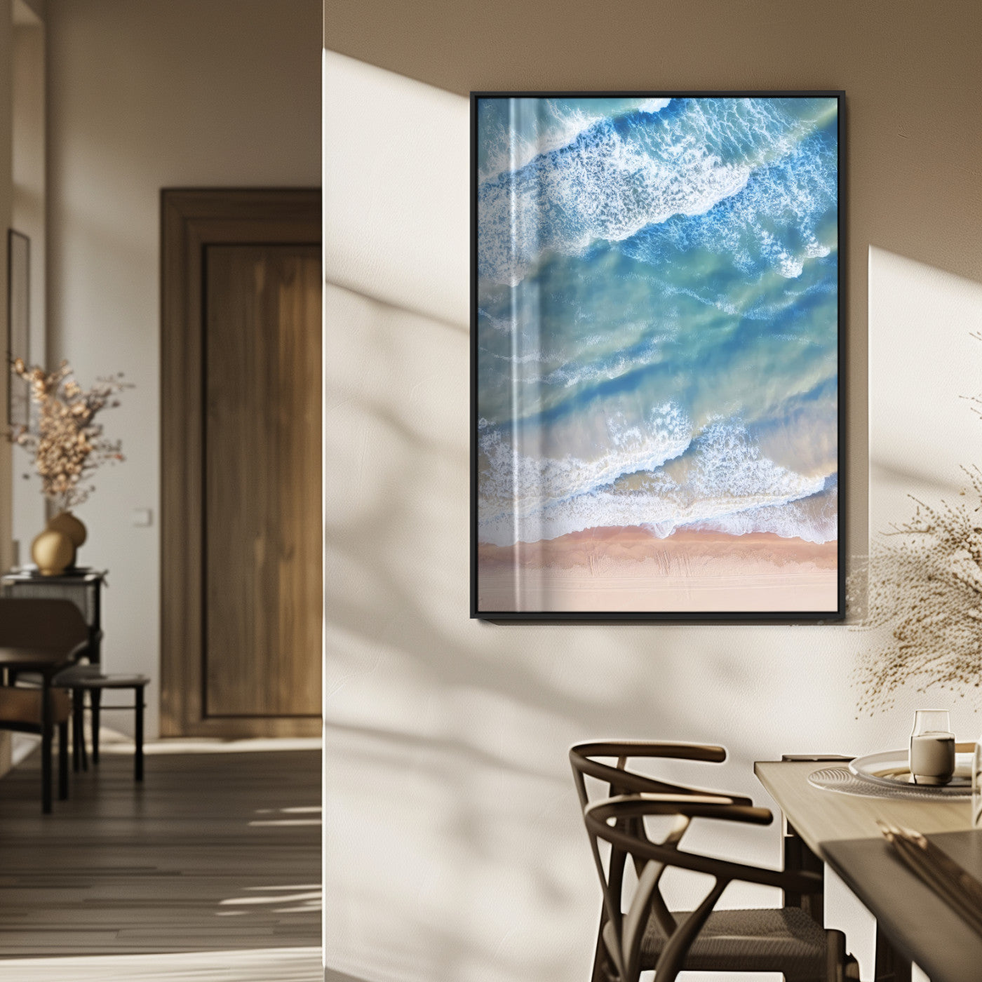 Aerial photo of soft blue waves meeting sandy shore, perfect for modern coastal or beach-themed decor with a light and tranquil aesthetic.