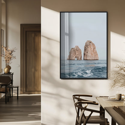 Serene photograph of the Faraglioni rocks in Capri with calm blue waters, perfect for Mediterranean coastal or minimalist travel-themed decor.