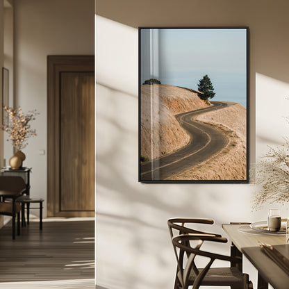 Earth-toned photograph of a winding road through golden hills, ideal for neutral or rustic-themed decor with a calming travel vibe.