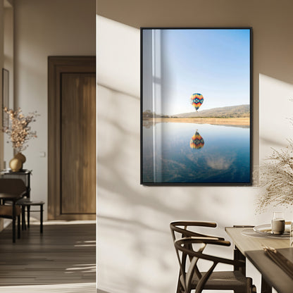 Canvas of a hot air balloon floating above a calm lake with soft reflections and vibrant sky, ideal for modern minimalist or adventure-themed home decor.