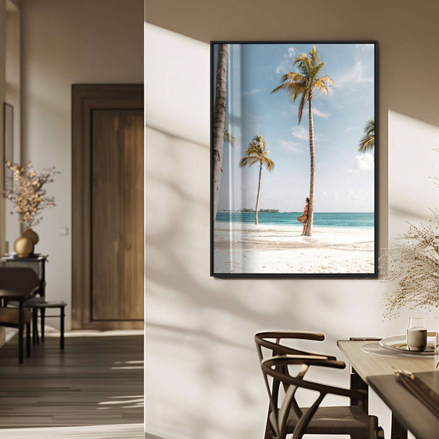 Person leaning on a palm tree at a tropical beach with white sand and turquoise water, perfect for coastal or beach-themed home decor.