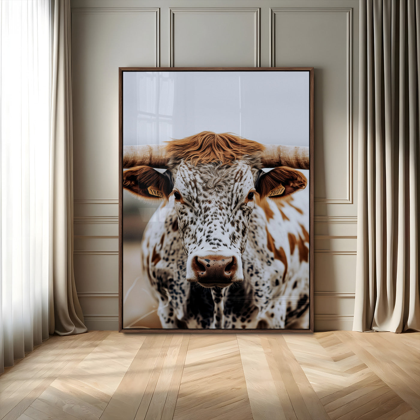 Close-up of a speckled Texas longhorn with wide horns and a bold gaze, perfect for rustic or country-style decor in warm tones.