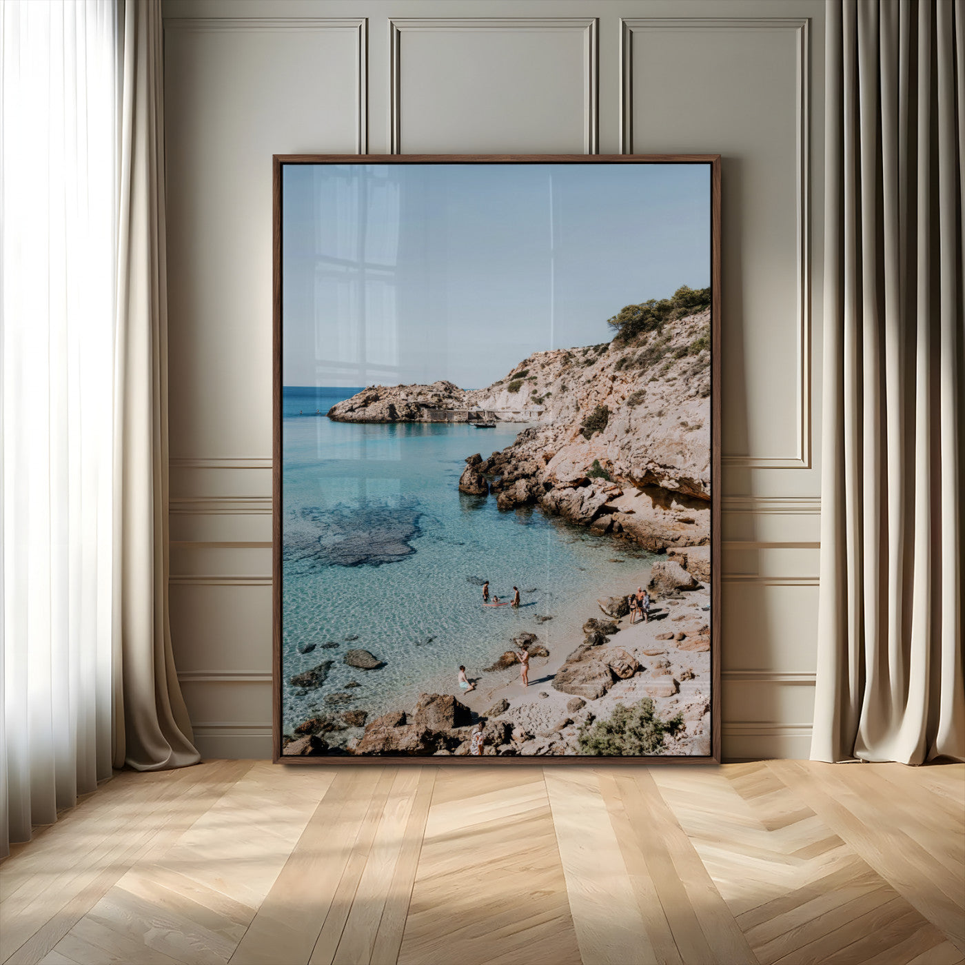 A vibrant coastal photo of a rocky Mediterranean cove with turquoise waters and beachgoers, ideal for boho coastal or summer-inspired interiors.