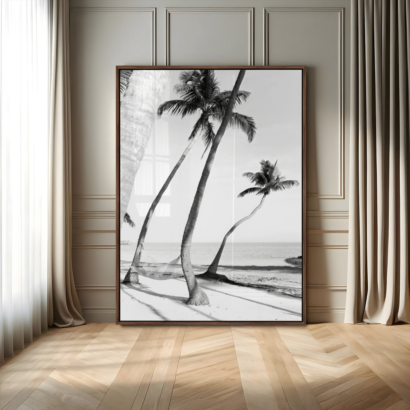 Black and white wall art of palm trees and a hammock on a beach, ideal for coastal minimalist or tropical-themed decor.