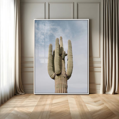 Vertical photo of a tall saguaro cactus against a soft sky, ideal for earthy or Southwestern home decor with warm neutral tones.