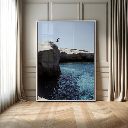 Canvas of a cliff diver above turquoise waters and rocky coastline under clear sky, ideal for adventurous minimalist or coastal home decor.