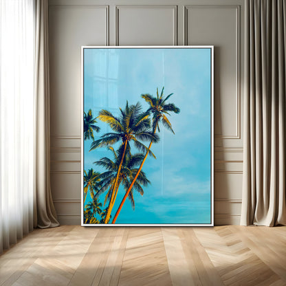 "Tall palm trees with golden sunlight against a vibrant blue sky, creating a tropical, relaxing atmosphere for coastal and beach-themed decor.