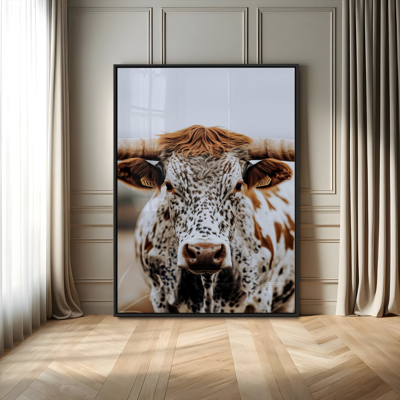 Close-up of a speckled Texas longhorn with wide horns and a bold gaze, perfect for rustic or country-style decor in warm tones.
