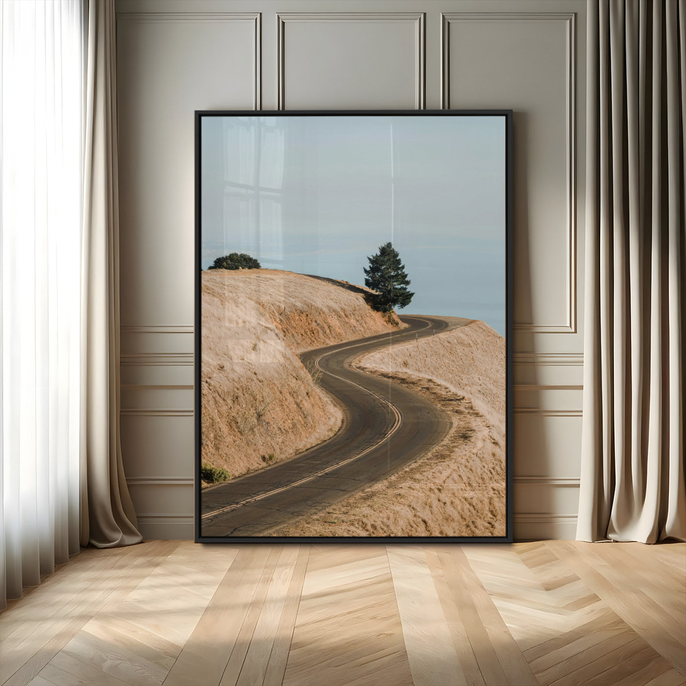 Earth-toned photograph of a winding road through golden hills, ideal for neutral or rustic-themed decor with a calming travel vibe.
