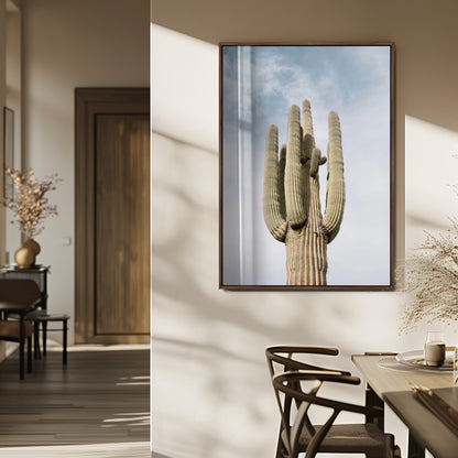 Vertical photo of a tall saguaro cactus against a soft sky, ideal for earthy or Southwestern home decor with warm neutral tones.