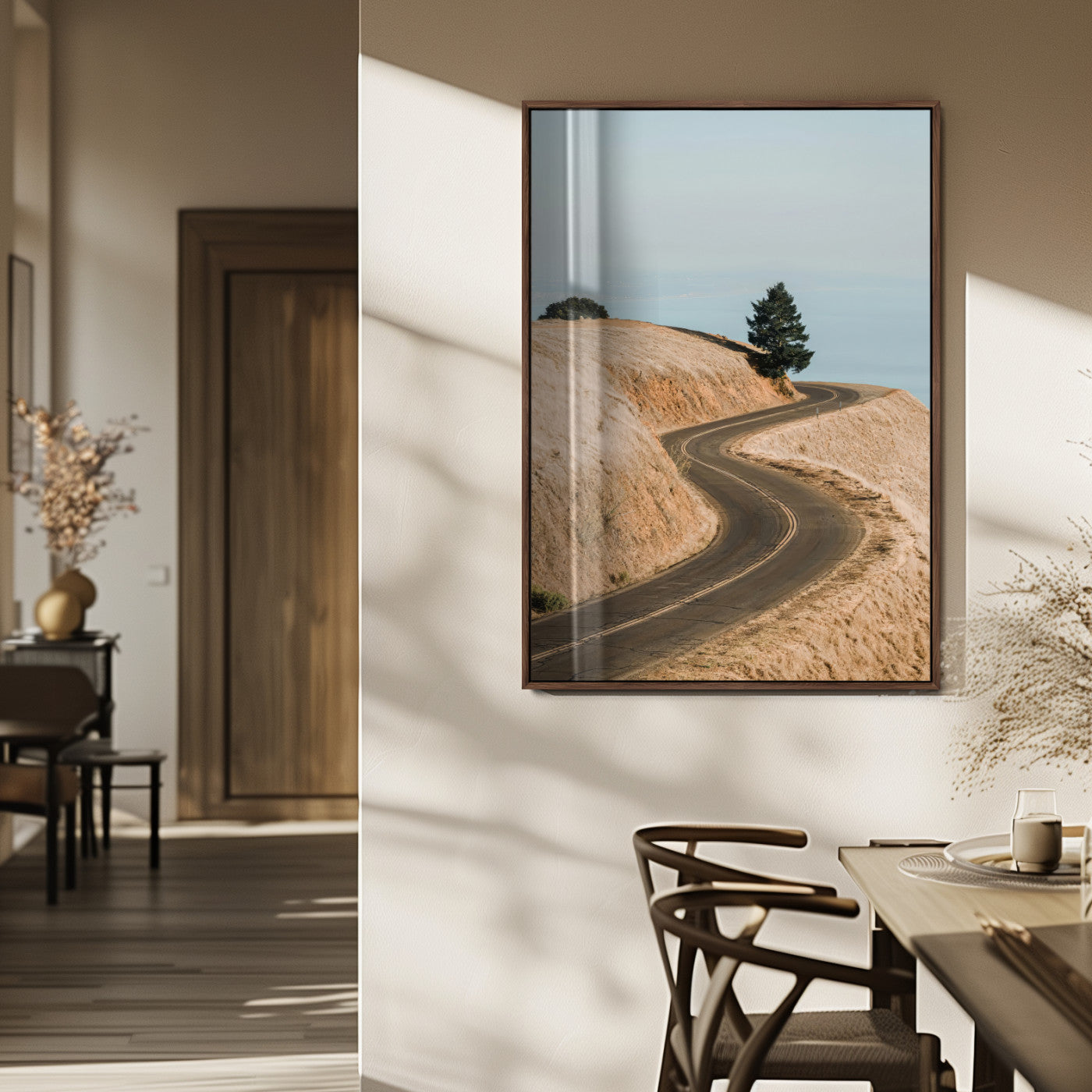 Earth-toned photograph of a winding road through golden hills, ideal for neutral or rustic-themed decor with a calming travel vibe.