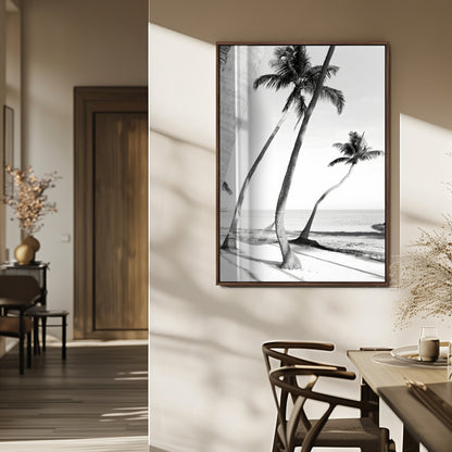Black and white wall art of palm trees and a hammock on a beach, ideal for coastal minimalist or tropical-themed decor.