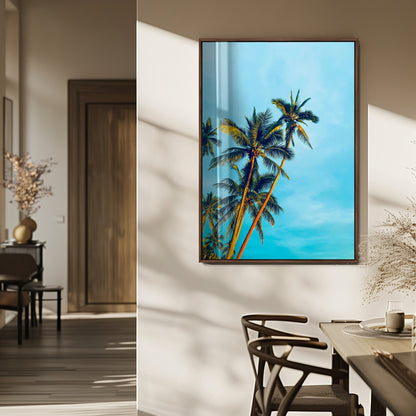 "Tall palm trees with golden sunlight against a vibrant blue sky, creating a tropical, relaxing atmosphere for coastal and beach-themed decor.