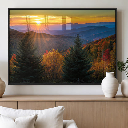 Vibrant sunset over autumn mountains with colorful trees and warm light, ideal for nature lovers or cabin-style wall decor.
