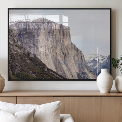 Framed canvas of El Capitan’s vertical granite face in Yosemite with snowy peaks, ideal for Sierra minimalism or mountain-inspired decor.