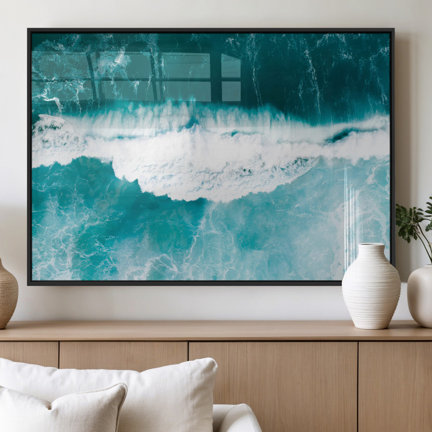 Aerial view of turquoise ocean waves crashing with white foam, perfect for tropical coastal or modern beach-style home decor.