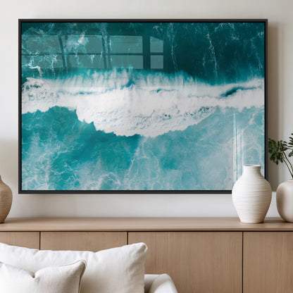 Aerial view of turquoise ocean waves crashing with white foam, perfect for tropical coastal or modern beach-style home decor.