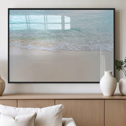Soft shoreline with gentle aqua waves on smooth sand, ideal for minimalist coastal or pastel ocean-inspired home wall decor.