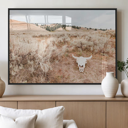Rustic bull skull on dry sagebrush field under soft light, ideal for western minimal or desert prairie-style wall decoration.
