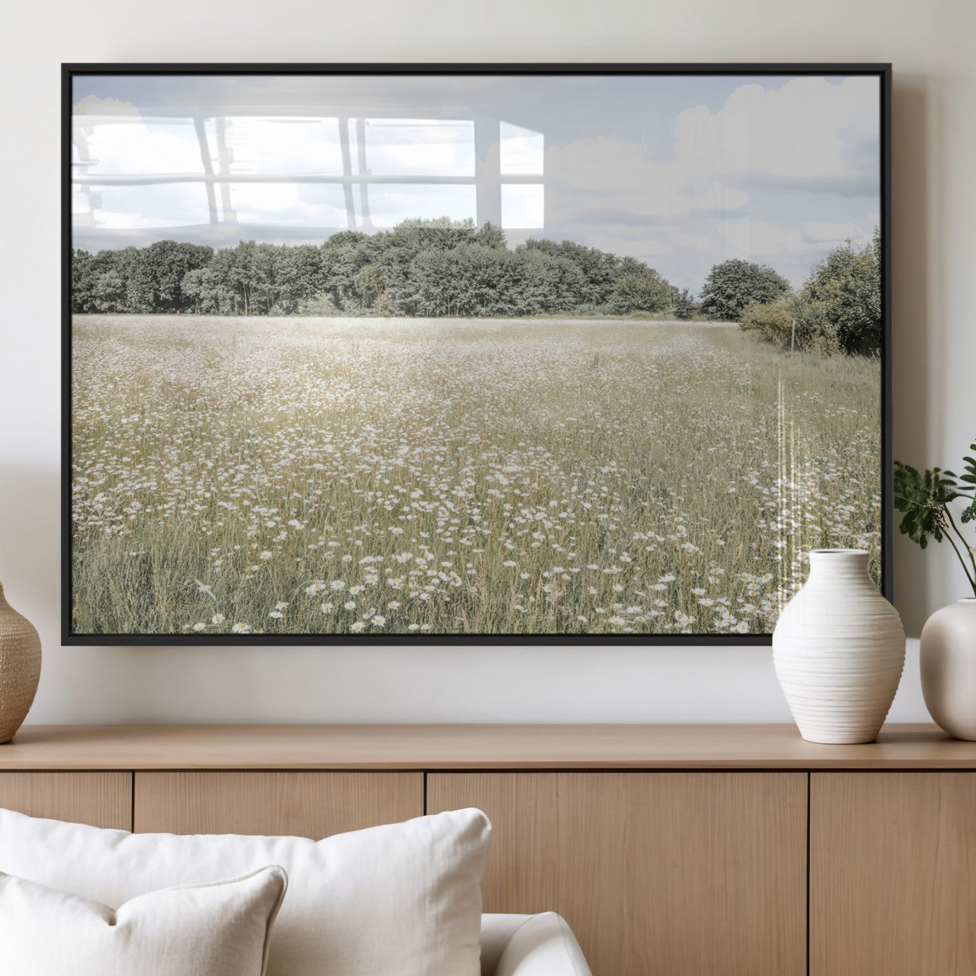 Soft-toned image of a wild daisy field under a cloudy sky, ideal for neutral or Scandinavian-inspired home decor.