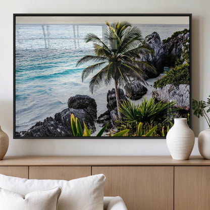 Framed canvas of a vibrant tropical coastline with palm trees, rocky cliffs, and turquoise waters, ideal for tropical coastal home decor.