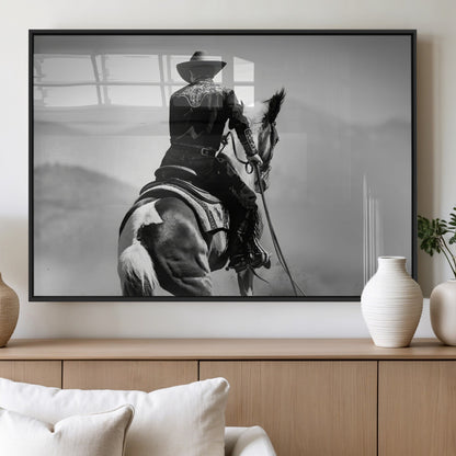 Black and white canvas of a cowboy on horseback with moody tones, perfect for rustic western or country-inspired home decor.