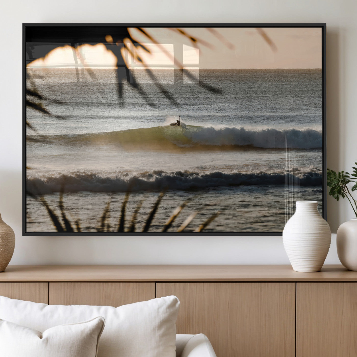 Photo of a surfer riding a golden hour wave at sunset, with tropical tones and dreamy light, perfect for tropical boho or coastal home decor.