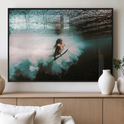 Vibrant underwater photo of a female surfer diving through turquoise waves, perfect for coastal boho or surf-inspired home decor.