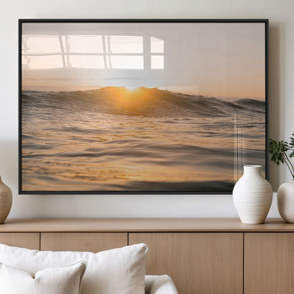 Ocean waves glowing under a warm golden sunset, reflecting soft light and calm movement, perfect for warm minimalist coastal interiors.