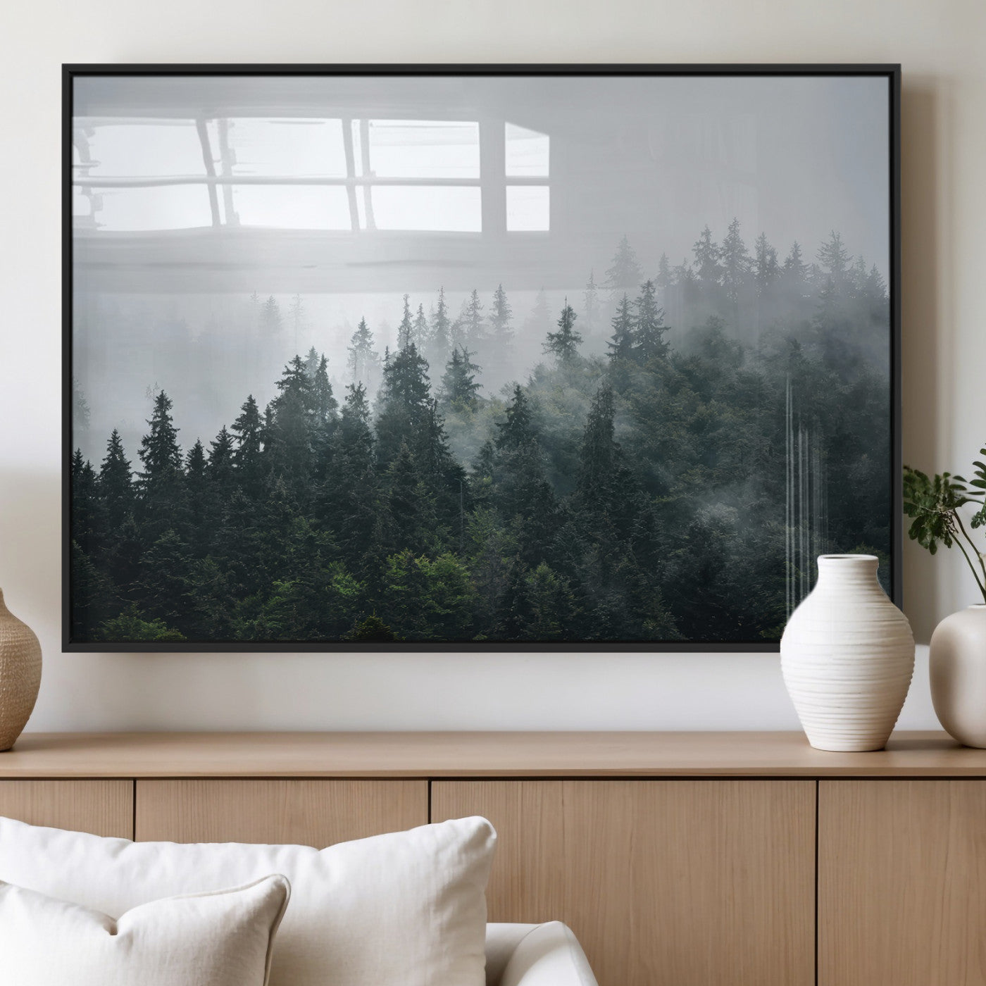 A misty evergreen forest shrouded in soft fog, creating a tranquil and moody landscape with lush green trees fading into the distance.