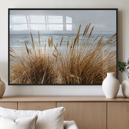 Canvas of golden beach grass swaying by the ocean under a soft cloudy sky, perfect for neutral-toned or coastal minimalist decor.