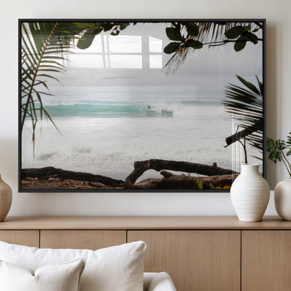 Tropical beach view with palm trees and surfer riding a wave, perfect for boho or coastal-inspired interior wall decor.