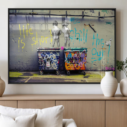 Graffiti-style canvas art with bold text and two naked figures over urban dumpsters, ideal for edgy or street-style decor.