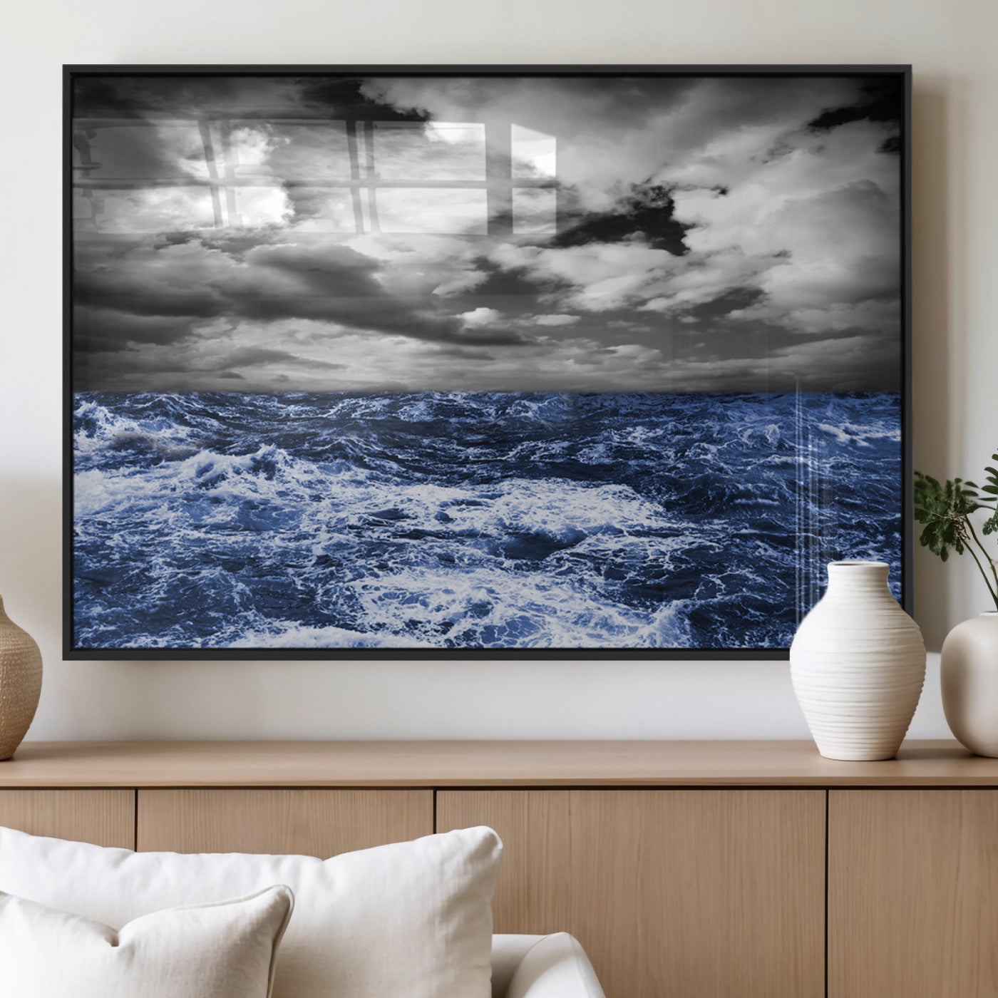 Moody canvas wall art of a stormy ocean under a dramatic black-and-white sky, perfect for bold or coastal-style interiors.