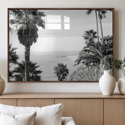 Monochrome canvas of palm trees framing a coastal surf scene, perfect for California-inspired or retro black-and-white beach decor.