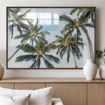 Framed canvas of tall palm trees reaching into a tropical sky, ideal for beach home or relaxed island-inspired wall decor.