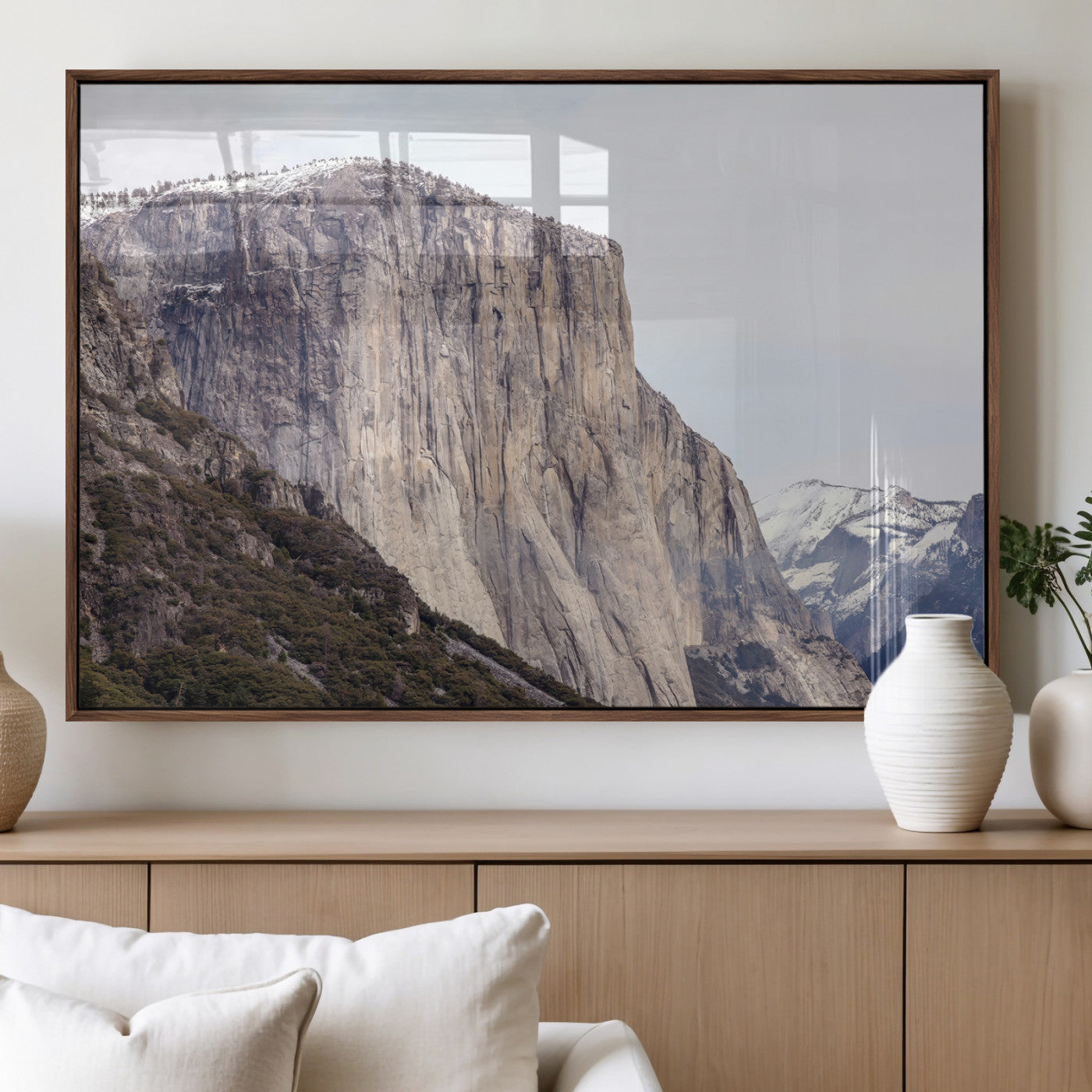 Framed canvas of El Capitan’s vertical granite face in Yosemite with snowy peaks, ideal for Sierra minimalism or mountain-inspired decor.