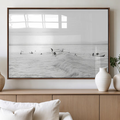 Monochrome photo of surfers riding and waiting on ocean waves, ideal for surf-themed or coastal energy wall decor.
