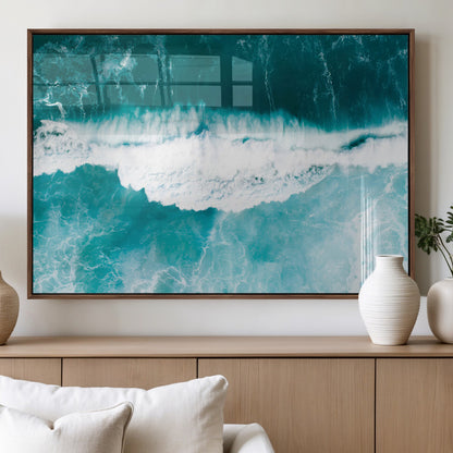 Aerial view of turquoise ocean waves crashing with white foam, perfect for tropical coastal or modern beach-style home decor.