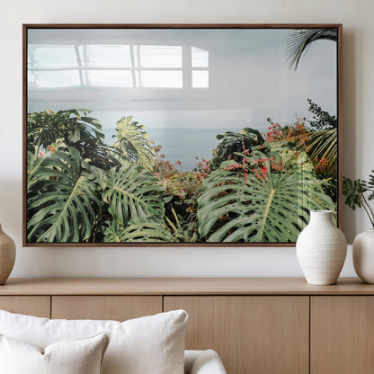 Monstera leaves and tropical flowers framing a calm ocean view, ideal for tropical coastal or exotic jungle-style interior wall decor.