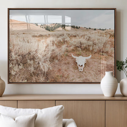 Rustic bull skull on dry sagebrush field under soft light, ideal for western minimal or desert prairie-style wall decoration.