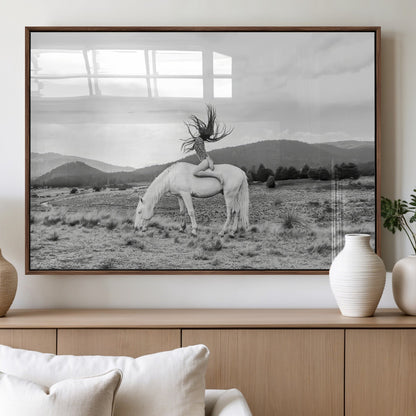 Black and white photo of a woman on a white horse in moody tones, ideal for Western Boho or modern rustic-style home decor.