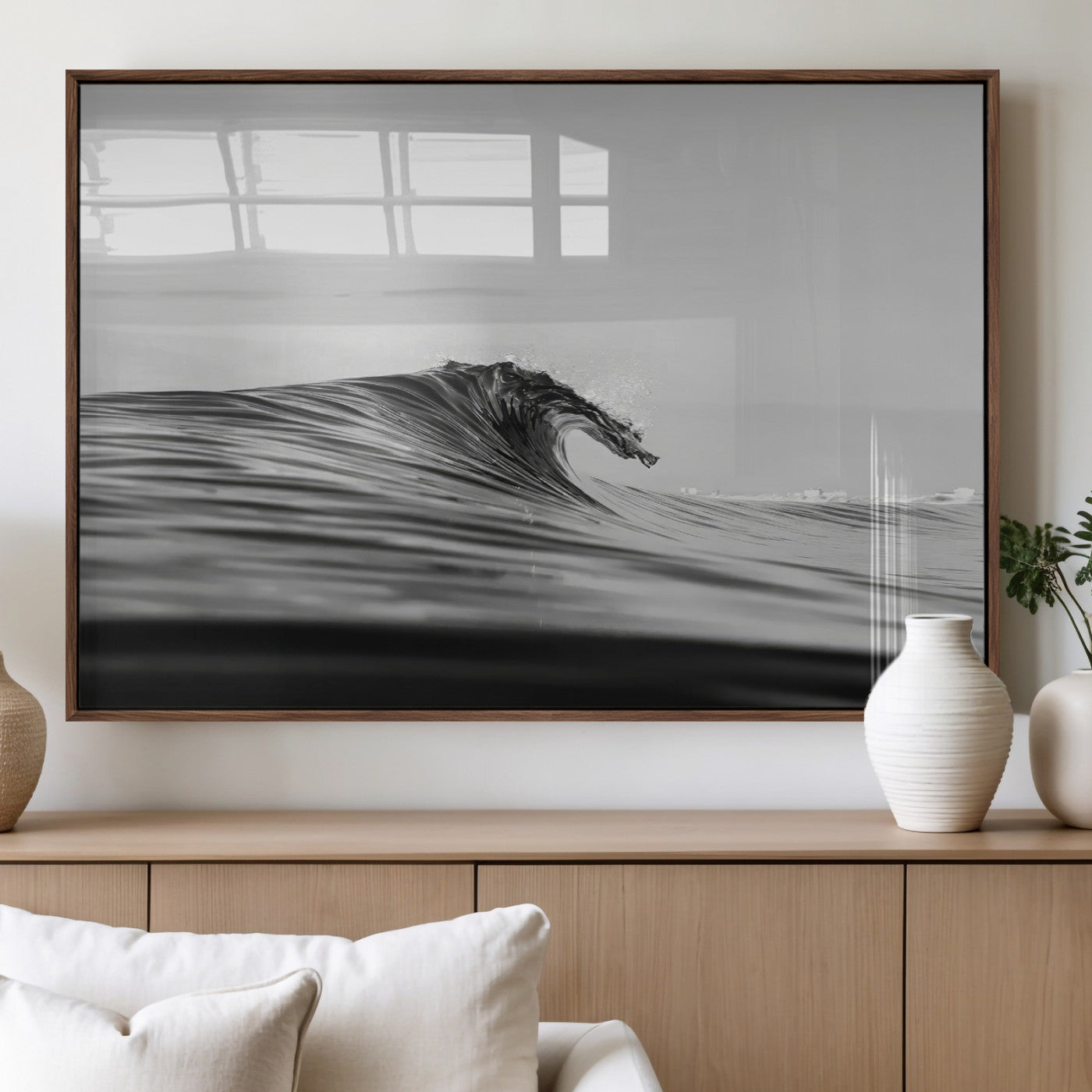 Striking black and white photo of a curling wave, ideal for modern coastal or minimalist wall decor settings.