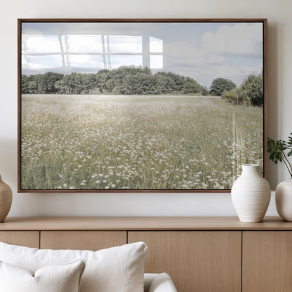 Soft-toned image of a wild daisy field under a cloudy sky, ideal for neutral or Scandinavian-inspired home decor.