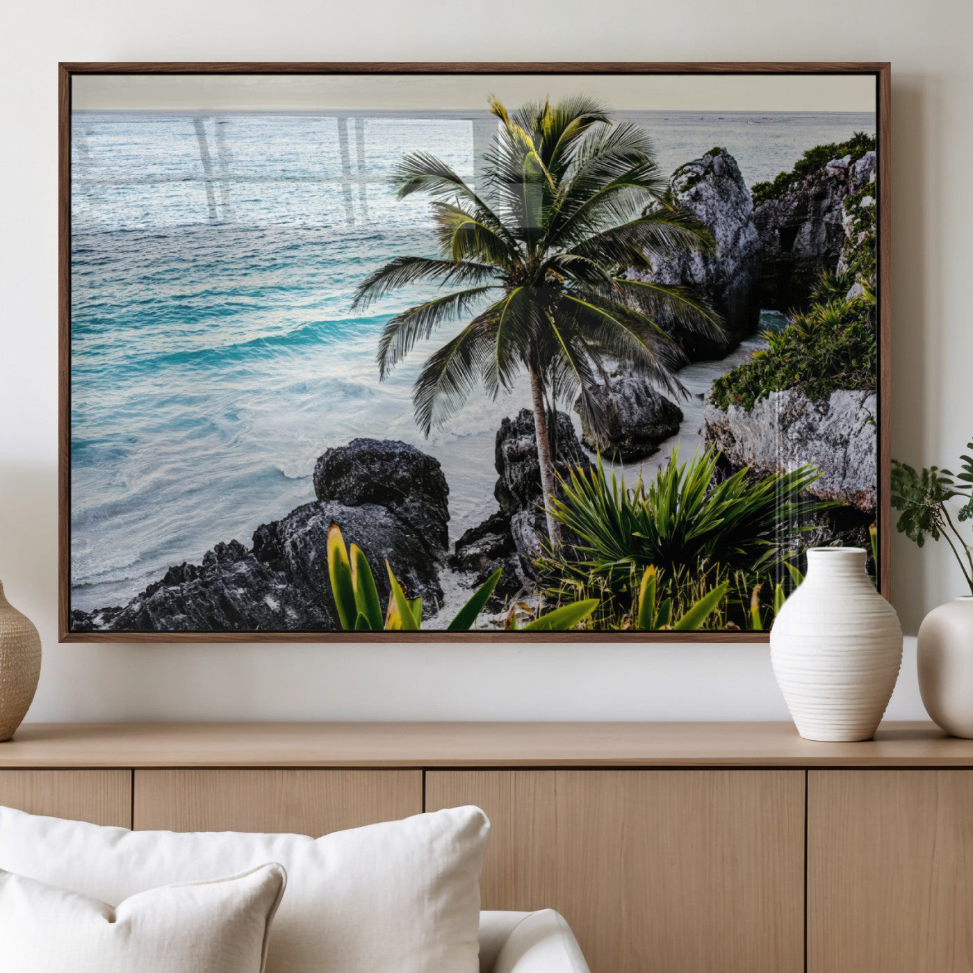 Framed canvas of a vibrant tropical coastline with palm trees, rocky cliffs, and turquoise waters, ideal for tropical coastal home decor.