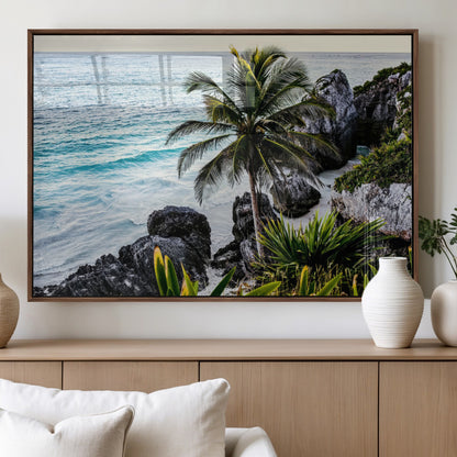 Framed canvas of a vibrant tropical coastline with palm trees, rocky cliffs, and turquoise waters, ideal for tropical coastal home decor.