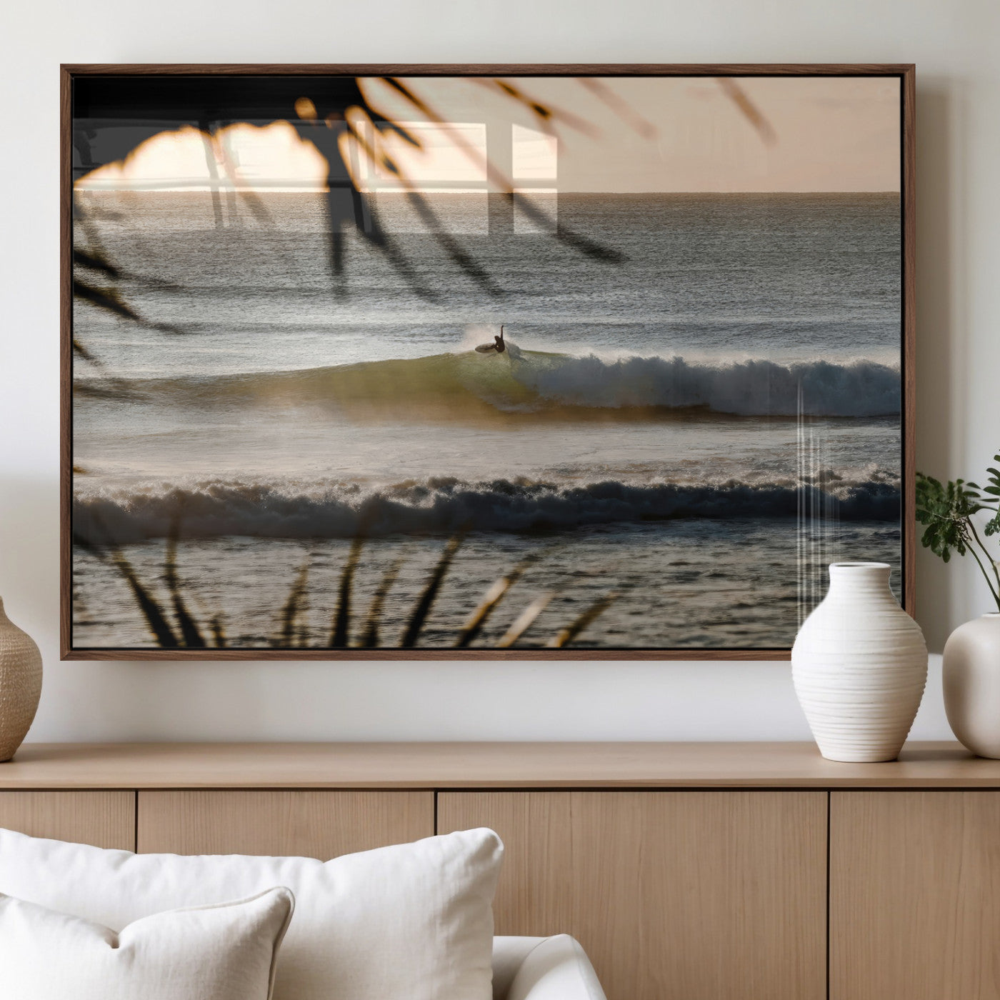 Photo of a surfer riding a golden hour wave at sunset, with tropical tones and dreamy light, perfect for tropical boho or coastal home decor.