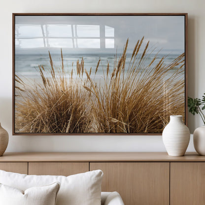 Canvas of golden beach grass swaying by the ocean under a soft cloudy sky, perfect for neutral-toned or coastal minimalist decor.